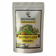 Bio Potash fertilizer package with potted plants in the background