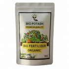 Bio Potash fertilizer package with potted plants in the background