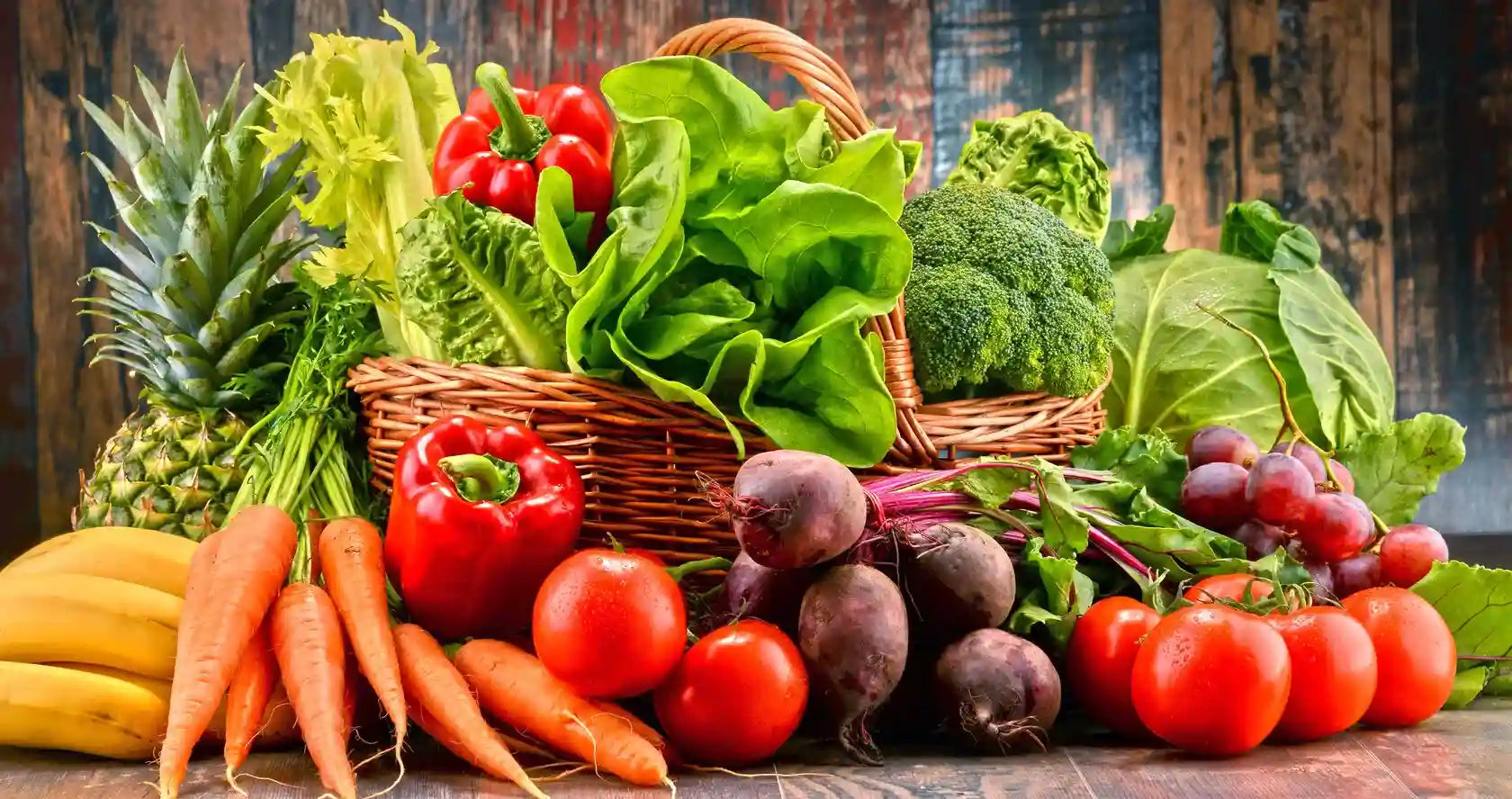 Fresh vegetables on a wooden surface with a rustic background